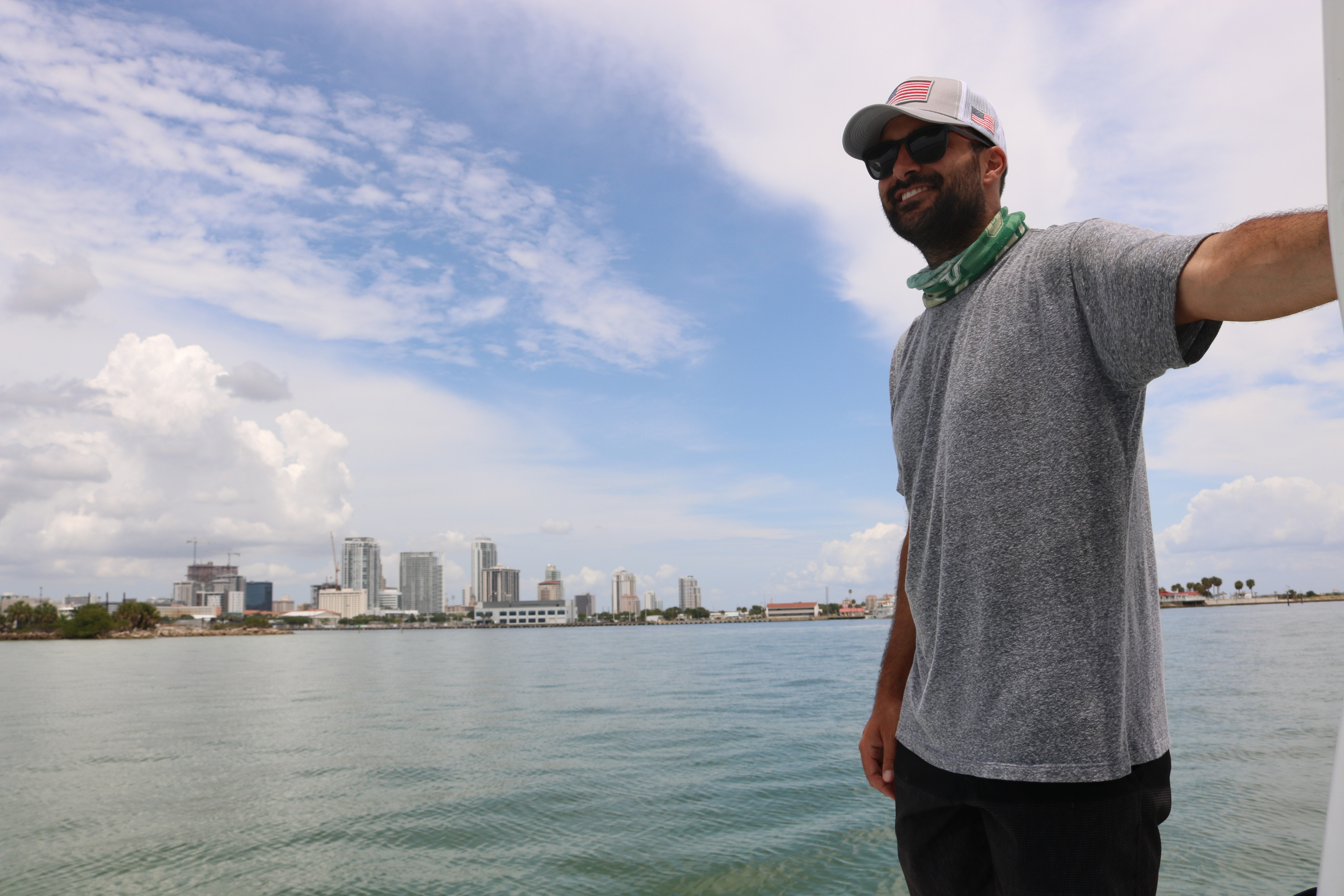 Devon Firesinger, Tampa Bay Surveillance Chemist, on the water with St. Pete in the background