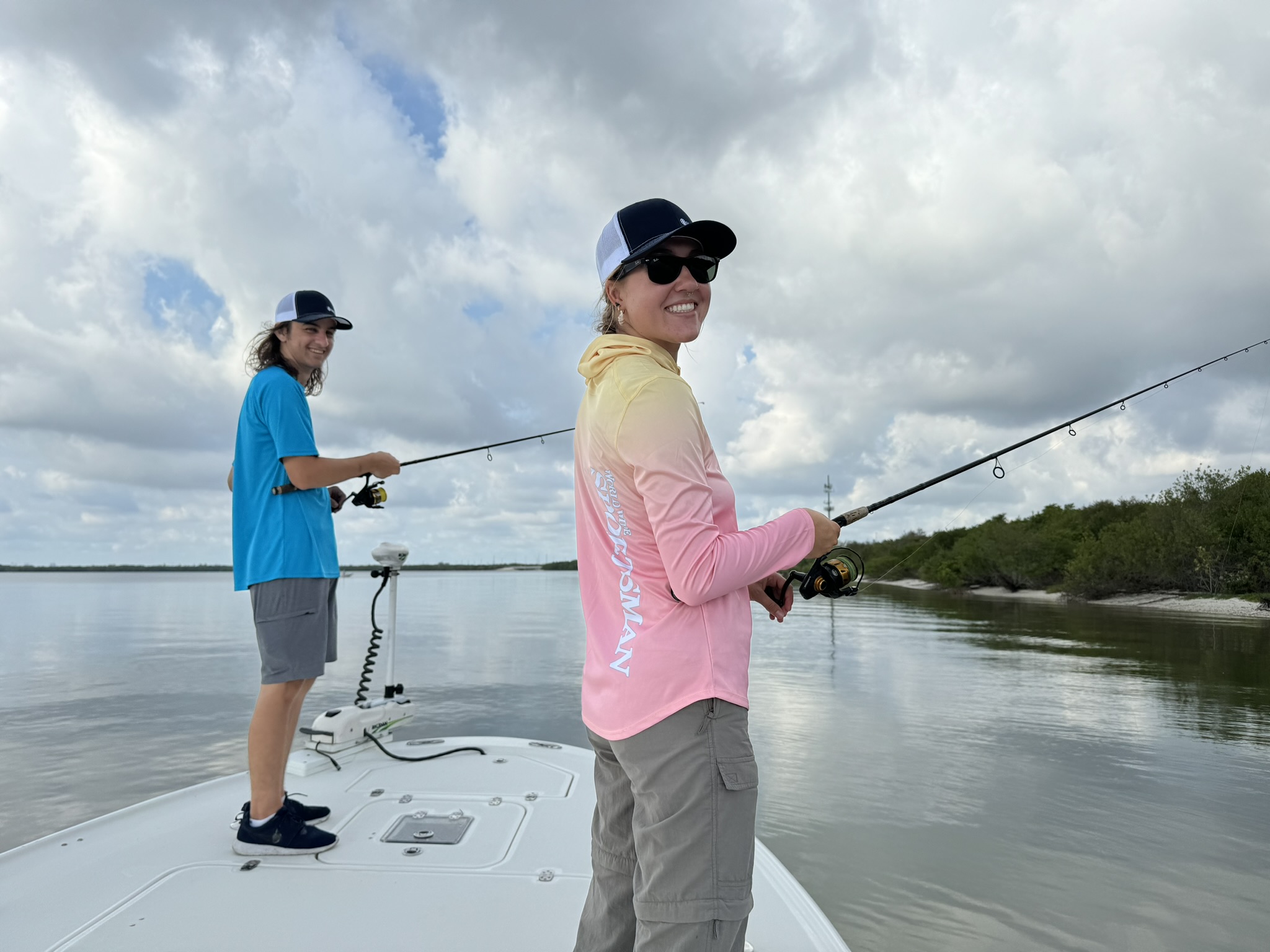 Tampa Bay Surveillance interns Ryan and Daisy fishing from a charter boat on Tampa Bay