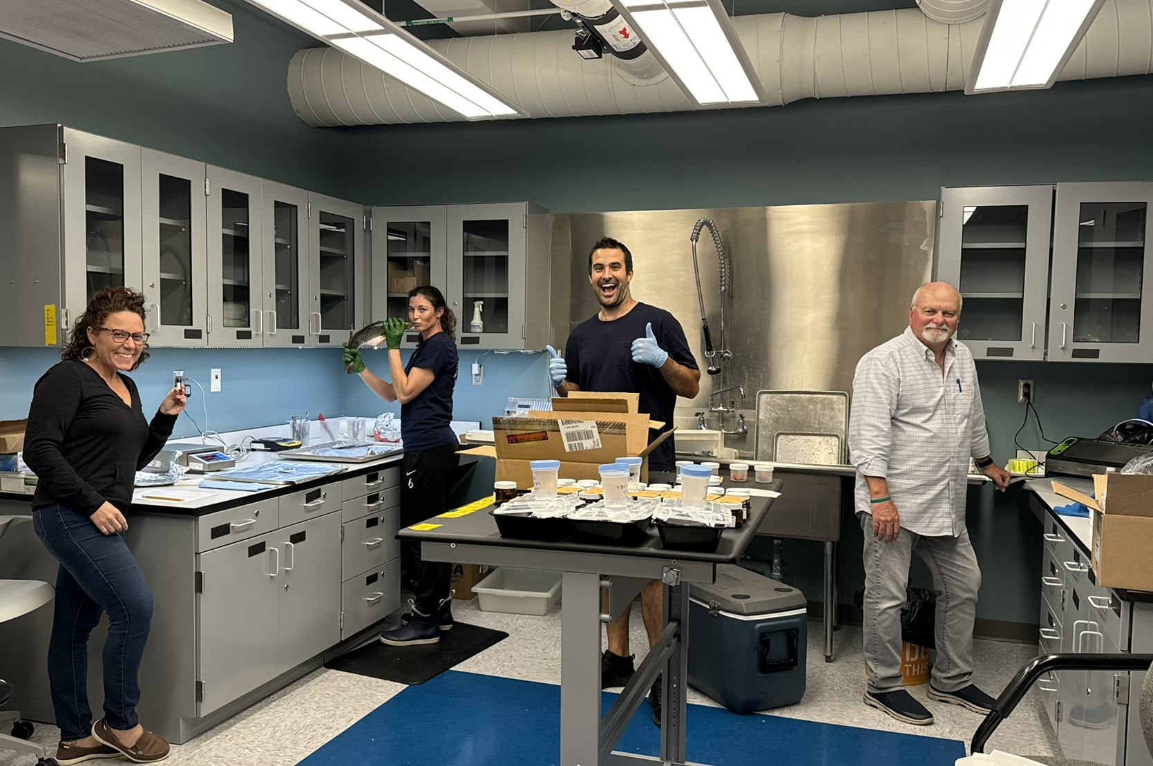 Tampa Bay Surveillance staff in the lab for fish dissection.